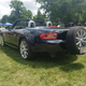 Apparently this is a relatively common Miata mod? There were a few like this. You have to wonder... is the rear end a pendulum now and what does that do to the handling?